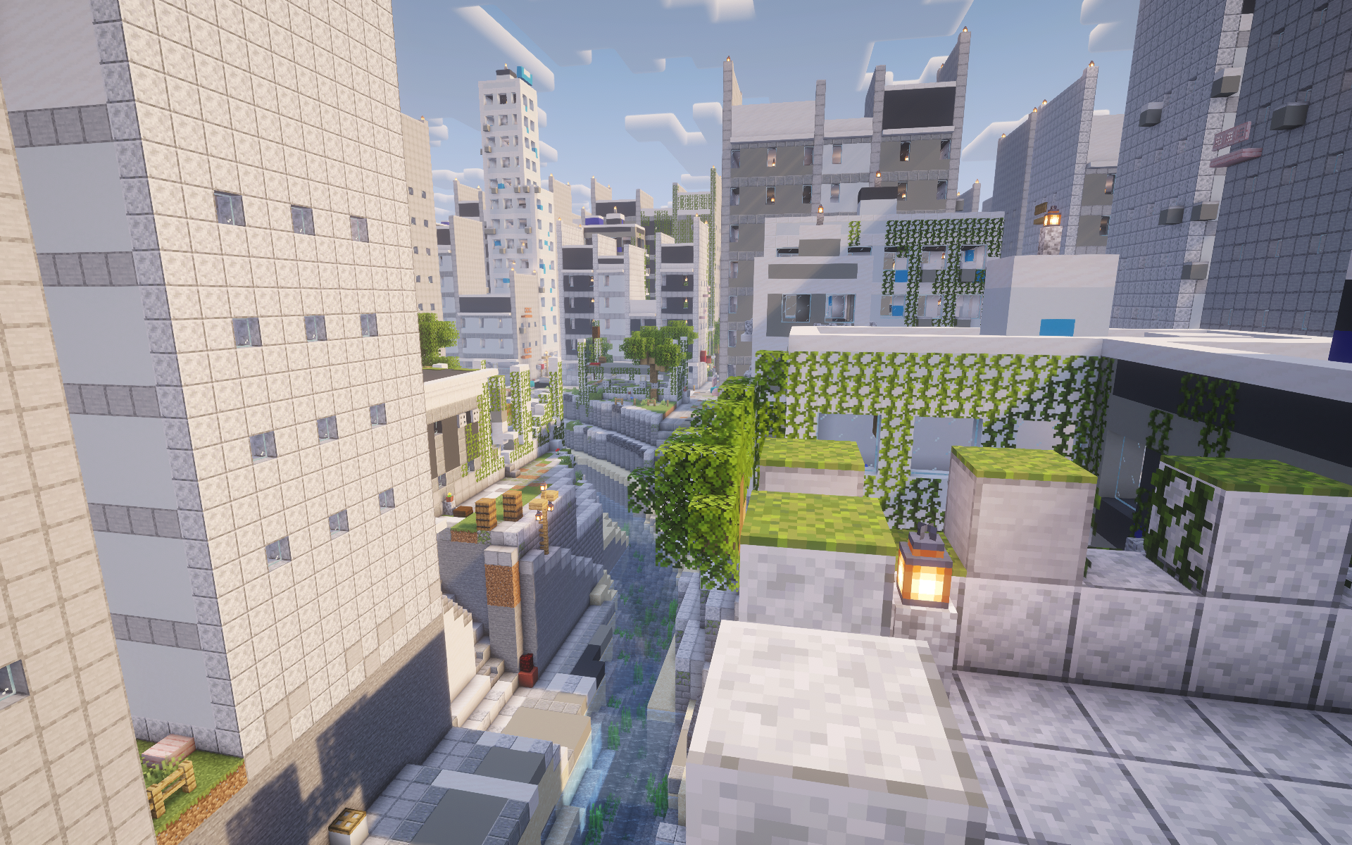 A bright modern Minecraft city crossed by a canal